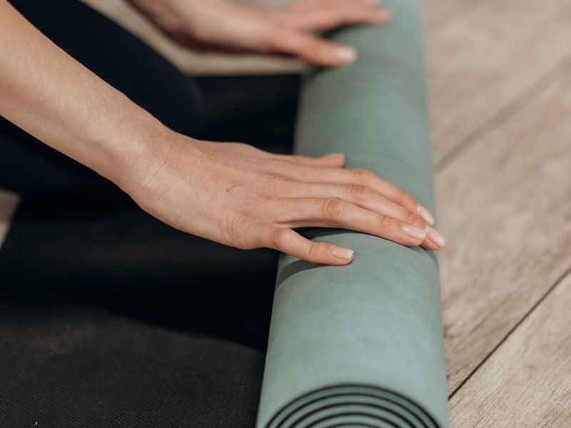 Person performing a smooth transition between yoga postures.